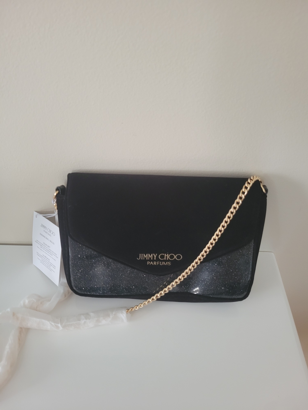 Jimmy Choo Black Glitter Crossbody Bag with Gold Chain.